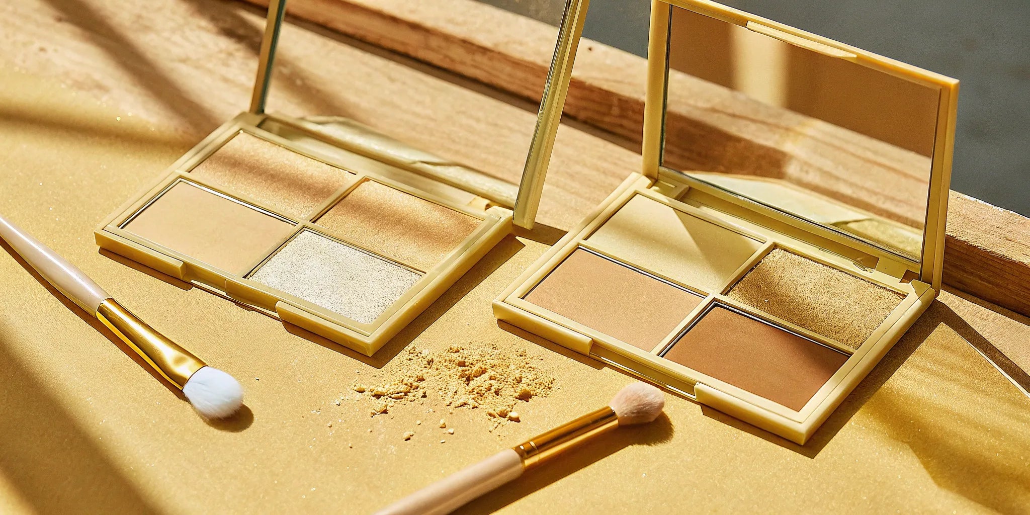 A collection of paraben-free eyeshadow palettes in neutral tones with makeup brushes.