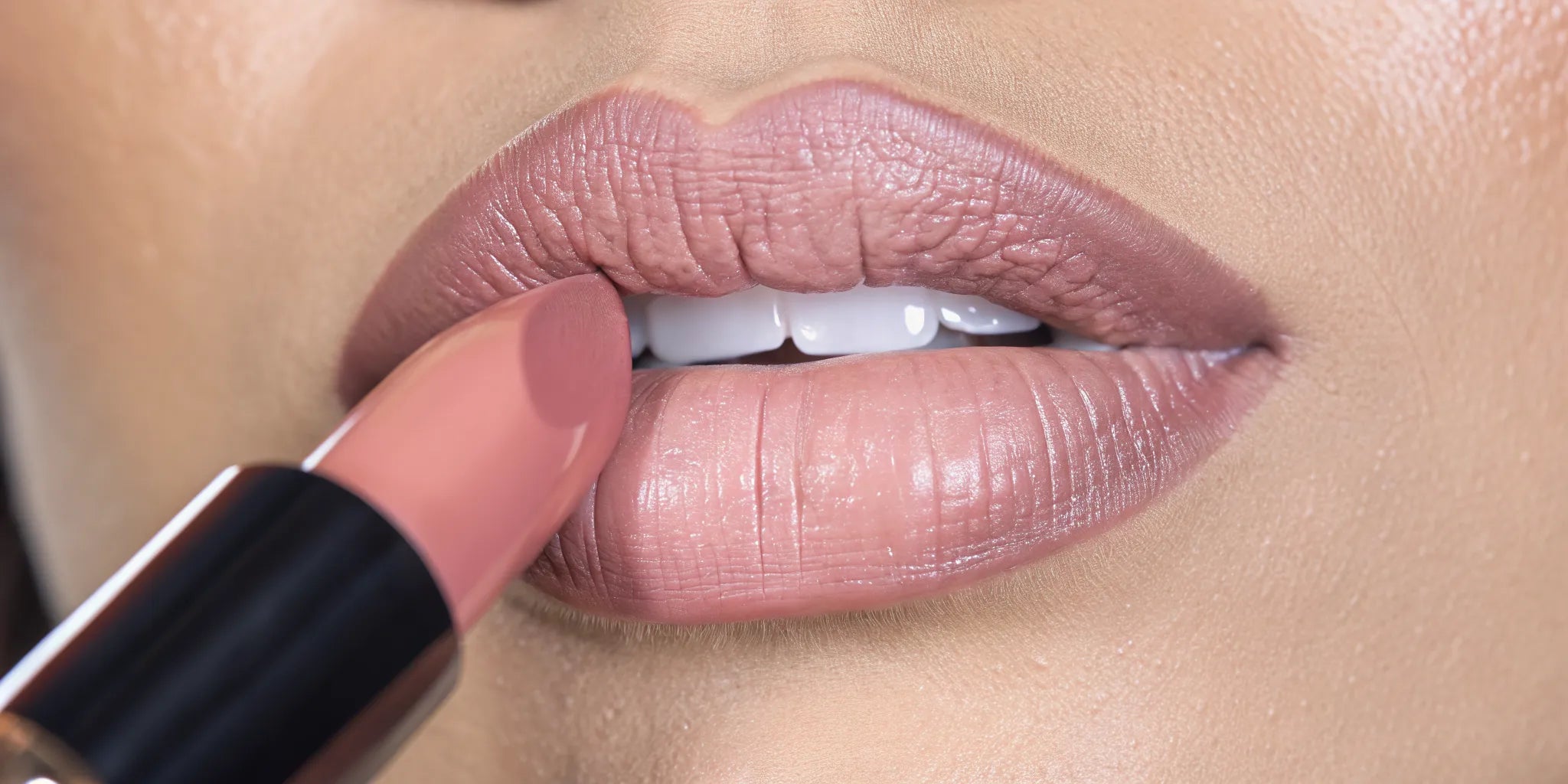 Woman with soft nude rose lipstick creating natural-looking fuller lips