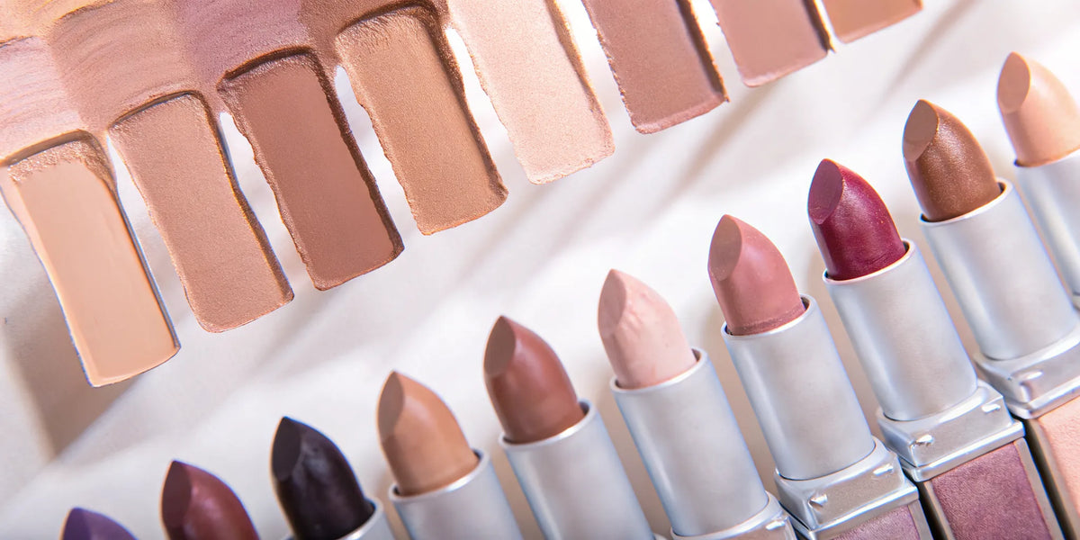 Nude lipstick shades swatched on dark skin showing rich pigmentation