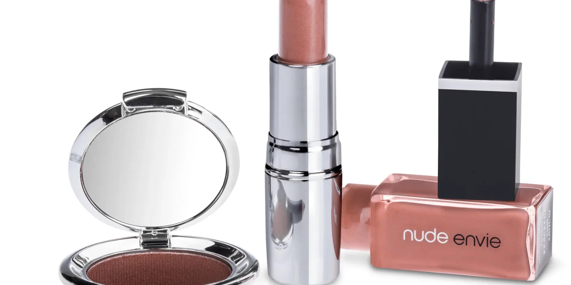 Curated nude makeup gift collection featuring coordinated eyeshadow, lip liner, lipstick, and lip gloss in warm neutral tones
