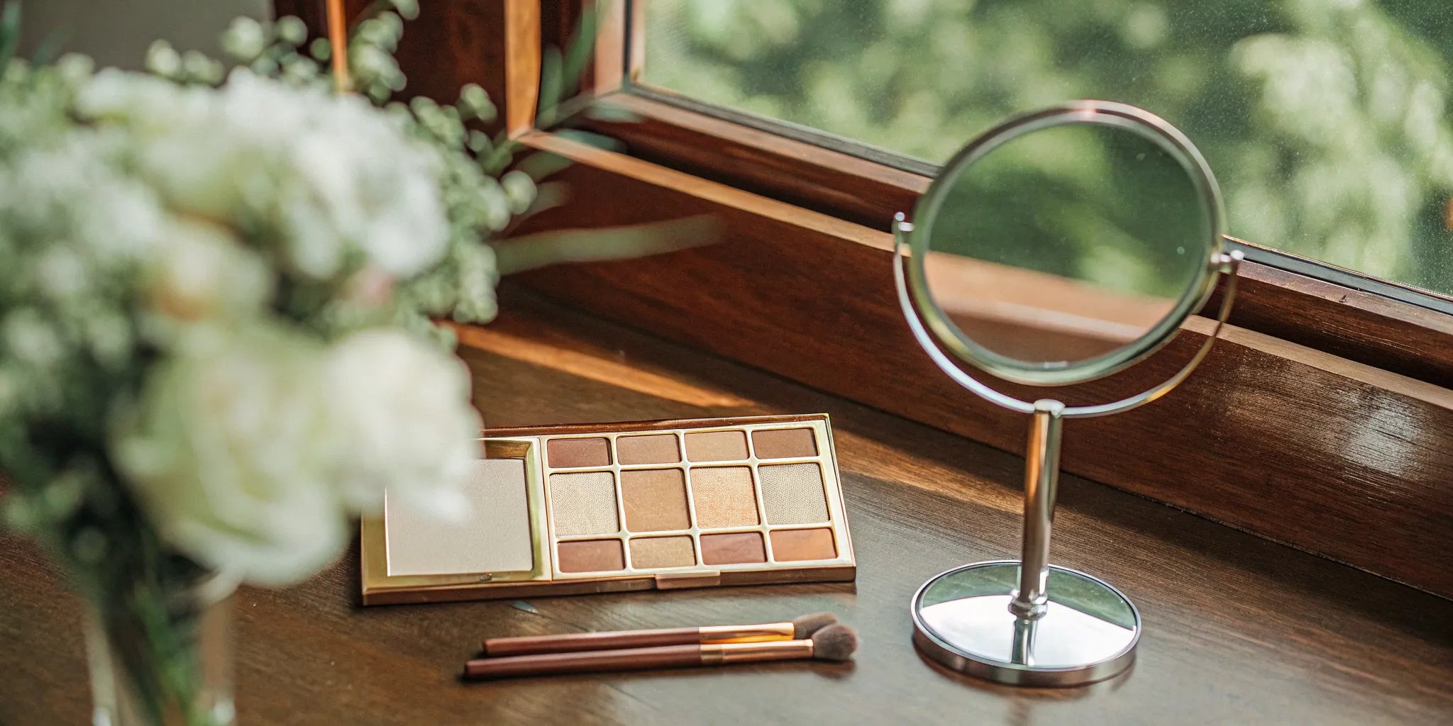 A neutral eyeshadow palette with makeup brushes, chosen as the best eyeshadow for mature eyes.