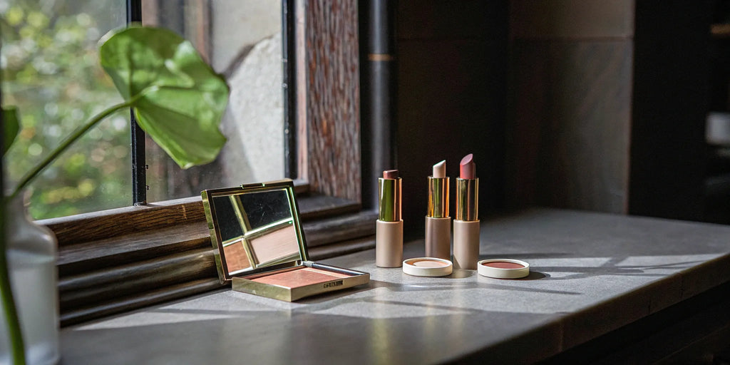 A collection of blush and lipstick from popular paraben-free makeup brands.