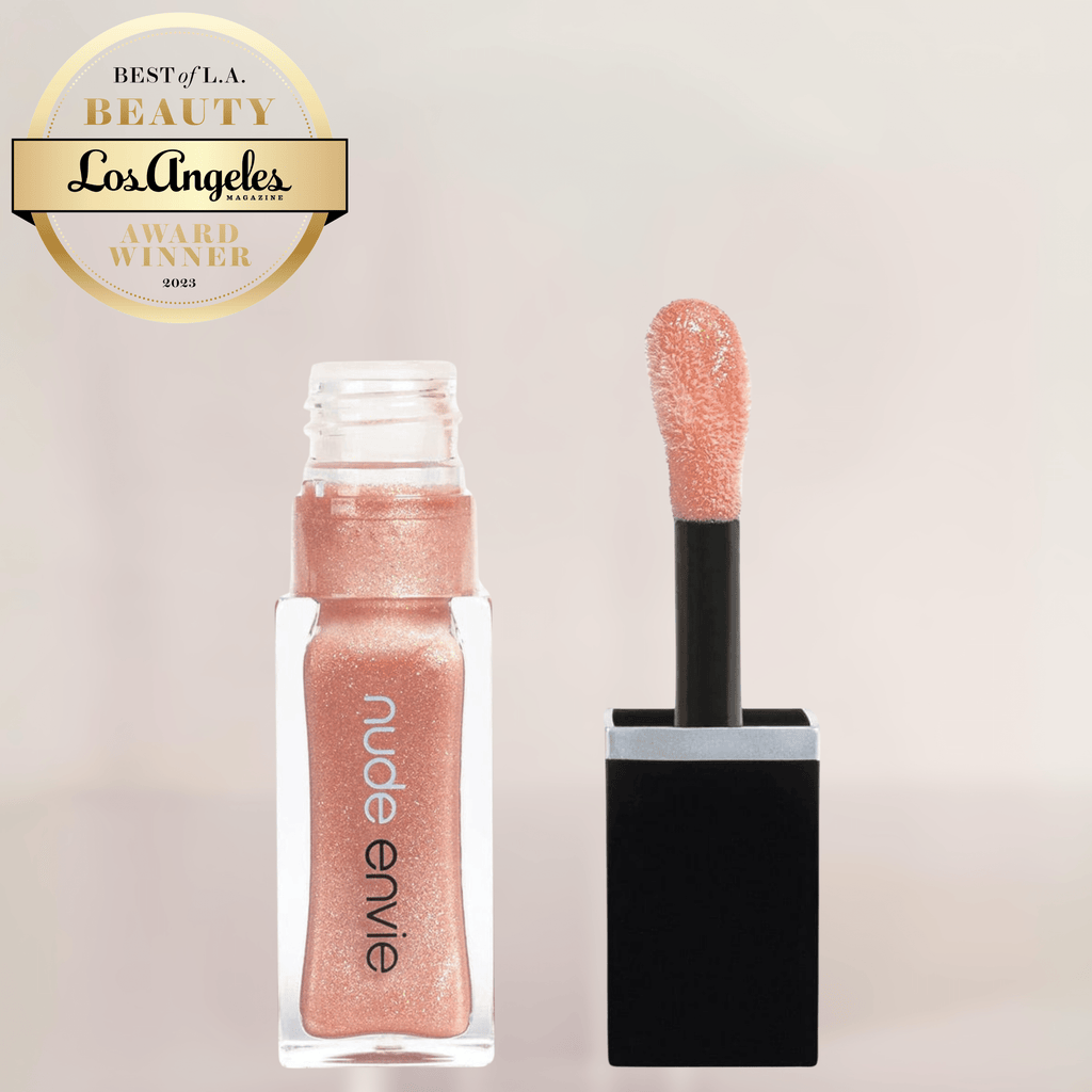 A sheer nude gloss with a pearly sheen, offers medium coverage and a high-shine finish, lightweight and silky for comfortable wear, perfect for a polished, radiant look