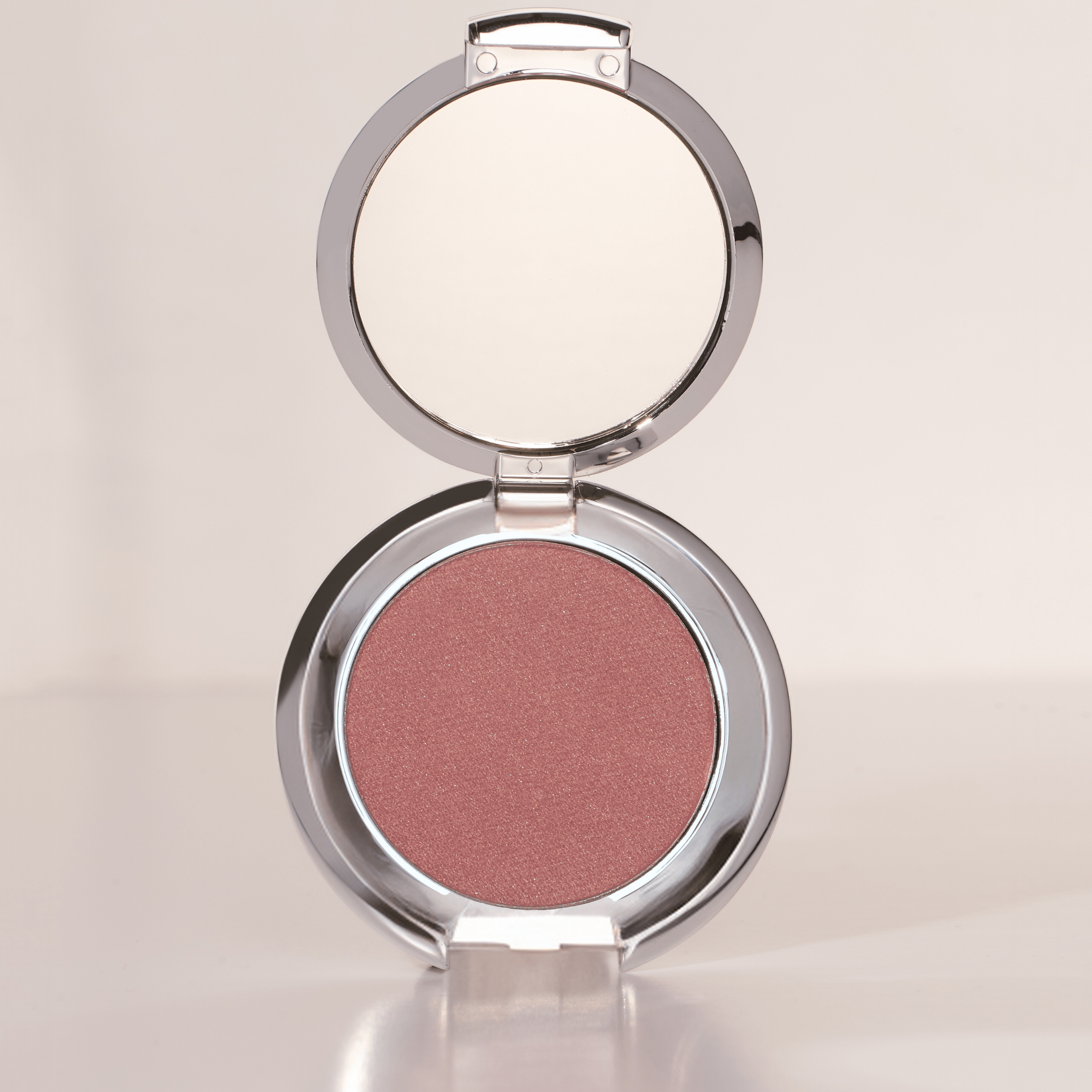 A soft, shimmering champagne eyeshadow with a silky-smooth texture, perfect for brightening and enhancing the eyes, blends effortlessly for a natural or dramatic look, versatile for day or night, long-lasting and buildable for customizable intensity