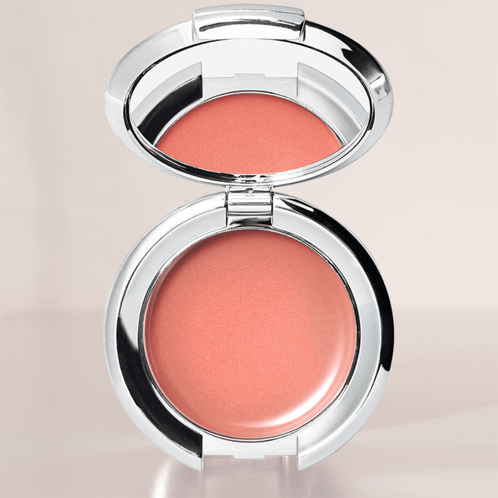 A warm peachy-pink cream blush with a radiant finish, enriched with nourishing ingredients for a smooth, dewy glow, blends effortlessly into the skin for a natural flush, buildable for customizable intensity, flattering on all skin tones, perfect for a youthful and luminous look